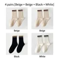4-pack crew socks set featuring ribbed stripes in beige, black, and white colors - One Size (EU 35-40) / 4 Pairs (2 Beige/1 Black/1 White)