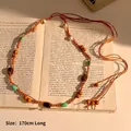 Détail de la chaîne de taille tissée main de 170cm avec perles en bois et coquillages - Style Tissé à Perles Multicolores