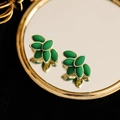Elegant vintage green leaf earrings with gold trim on a reflective mirror surface - 14k / Green