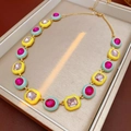 Close-up of gold chain necklace with colorful enamel squares and inlaid gemstones - Necklace Gold Colorful