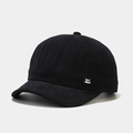 Detail of minimalist black cotton miki hat with white woven brand label on the side - Adjustable / Black