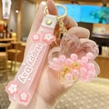 Pink cherry blossom liquid keychain with floating pearls and a soft silicone wristband - Pearl Sakura - Pink