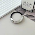 Elastic hair tie with a bold silver metal curved detail in a minimalist aesthetic - Style O Silver