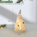 Ceramic Santa gnome LED figurine with star cutouts and warm glow for Christmas decor - Santa Claus