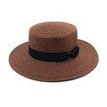 Detail view of brown flat top straw hat with black bow ribbon and fine woven texture - M (56-58cm) / Coffee