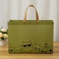 Green non-woven shopping bag featuring cute cartoon cat prints and yellow handles - Khaki Cat / Horizontal 27*32*10cm