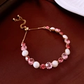 Detail of adjustable slider chain bracelet with pink crystals and pearls on silk fabric - Pink