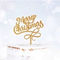 Close-up of golden glitter Merry Christmas acrylic cake topper on white frosted cake - Gold Script Merry Christmas / Thick Acrylic