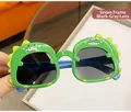 Lunettes de soleil dinosaure vert pour enfants avec verres gris et branches bleues - Vert