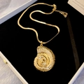 Detail of golden nautilus shell pendant with flat snake chain in black gift box - Gold Metal Nautilus Pendant Style