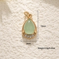 Detail view of a 15mm pear-shaped green gemstone pendant with 18K gold-plated textured frame - Aventurine Water Drop Pendant