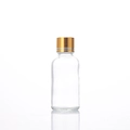 50ml; Gold-lined Cap + Inner Stopper + Clear Bottle; Glass