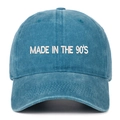 Close-up of 'MADE IN THE 90'S' white embroidery on washed blue cotton baseball cap - Lake Blue