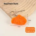 Carrot-shaped orange dumpling keychain with detailed texture and 6cm metal chain link - Carrot Dumpling - Keychain Style