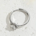 Silver adjustable solitaire ring with a large round-cut zircon and halo setting - Single Zirconia White Gold