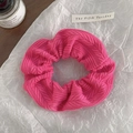 Detail of herringbone knit fabric on bright pink oversized scrunchie hair accessory - Rose Red