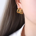 Minimalist 18K gold-plated C-shaped earrings with black zircon rows on female model - F910 Green Rhinestone Earrings