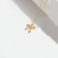 Elegante goldene Schleifen-Halskette mit funkelnden Zirkonia-Steinen im minimalistischen Stil - Flache Voll Zirkonia-Schleife