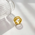 Macro detail of triple-layered 18K gold plated titanium ring with polished finish - Triple Layer Band / US 6