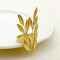 Minimalist golden ring featuring intricate leaf design with detailed branch texture - Plant Branch
