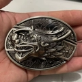 Detailed close-up of antique silver dragon head buckle with 3D embossed texture - Chinese Dragon Head