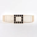 Detail of beige elastic waist belt with gold square buckle and black gemstones - Beige with Black Buckle