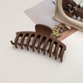 Detailed view of large matte dark brown hair claw clip with its reflection in a mirror - Keel / Dark Coffee