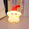 Star-shaped night light wearing a red Christmas hat with soft warm glowing light - Star with Red Hat