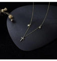 Close-up of gold clavicle necklace featuring sparkling cross, heart, and star pendants - Heart Cross Design Necklace Gold