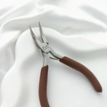 Close-up of high-quality stainless steel bent nose pliers with brown non-slip handles - Bent Nose Pliers