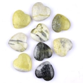 Polished natural heart-shaped stones in green, grey, and black on a white background - Cauliflower Jade