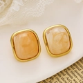 Detailed macro view of vintage square gold-plated earrings with amber resin texture - Vintage Square (KE027) / Gold + Orange