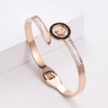 Elegante bracciale quadrifoglio in oro rosa con zirconi bianchi e neri incastonati - Oro rosa