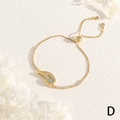 Detail of adjustable gold shell bracelet with blue enamel and micro-pave zircons - Blue Wave Spiral Style (BR1768-D)