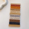 Detail of multi-colored braided elastic hair ties neatly arranged on kraft paper card - Bamboo Texture Grey Coffee Set / 32 Pieces