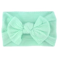 Soft mint green infant headband featuring a wide jacquard knit texture and a large bow - Light Green