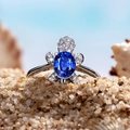 Silver sea turtle ring featuring an oval blue gemstone and shimmering zircon pavé - Royal Blue Rhinestone