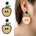 Acrylic apple-shaped earrings with red accents and green leaves, close-up and model view - Apple