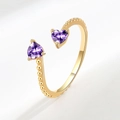 Adjustable gold open ring featuring dual heart-shaped purple gemstones and beaded texture - February (Dark Purple)