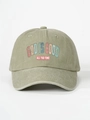 Detail of God Is Good printed text on vintage washed olive green baseball cap surface - Light Khaki