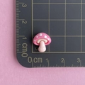 Macro shot of a tiny pink resin mushroom charm on a measuring mat for nail art use - Mini Mushroom