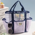 Multi-pocket mesh beach bag in white and purple with navy blue handles and text patch - Light Purple