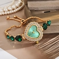 Elegant gold quartz watch with heart green crystals and luxury diamond bezel for women - Green
