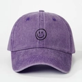 Detailed macro of a purple washed cotton baseball cap featuring a black smile graffiti embroidery - Purple / One Size