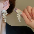 Silver layered fan-shaped earrings with metallic texture shown on a female model - Fan Layered Long Style (66#)
