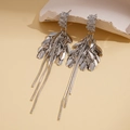 Close-up of silver tassel earrings with zircon studs and metallic leaf pendants - Silver (Silver Pin) / Silver