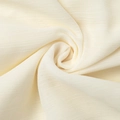 Macro view of cream chiffon fabric showing detailed horizontal pleated texture and soft drape - S / White
