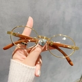 Gafas de sol ovaladas retro de metal dorado con patillas de madera para un look moderno - Blanco Transparente