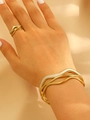 Set gioielli a onde in oro e smalto bianco con anello e bracciale coordinati - Set Bracciale e Anello Onda in Smalto Multistrato