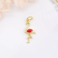 Detail view of a gold-plated flamingo pendant with red enamel inlay for DIY jewelry - Red